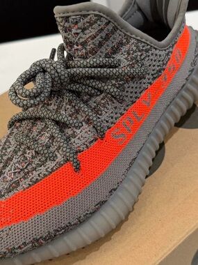 Yeezy Grey Knit Sneakers with Bright Orange Stripe